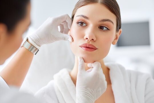Dermatology billing specialists reviewing patient charts