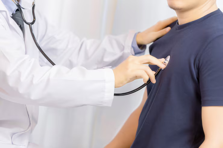 Cardiology billing specialists reviewing patient charts