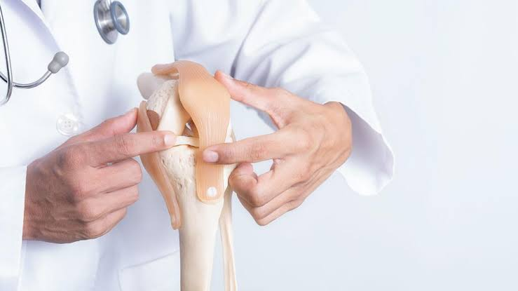Orthopedic billing specialists reviewing patient charts