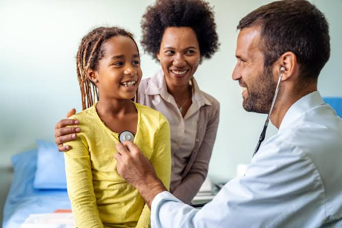 Family practice billing specialists reviewing patient charts