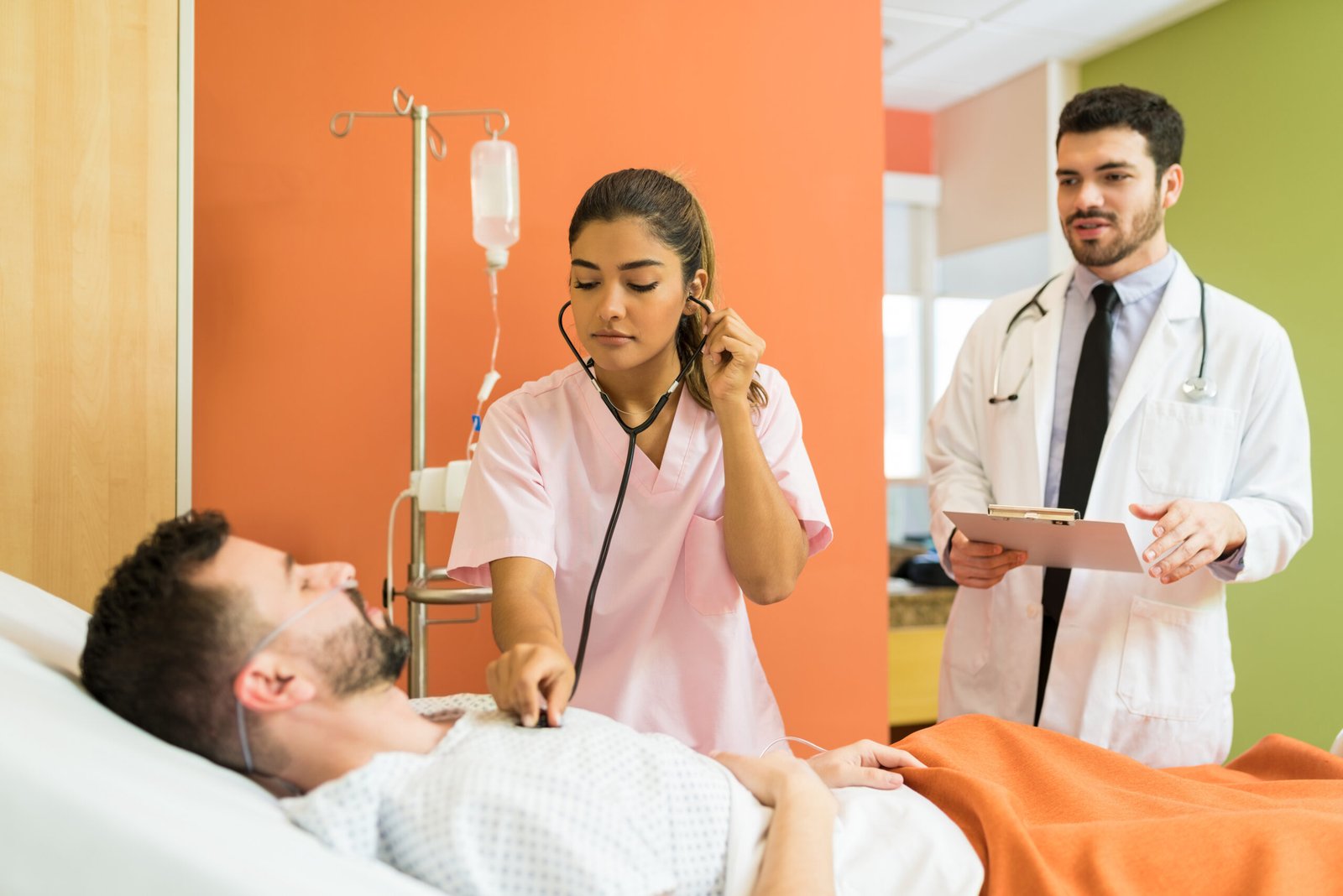 Emergency department physician reviewing patient care and billing information