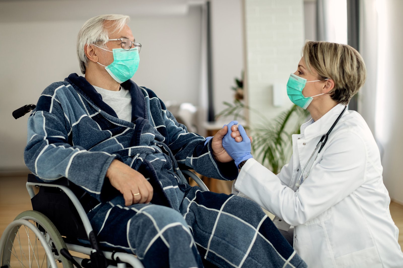 Caregiver assisting a resident in an assisted living community