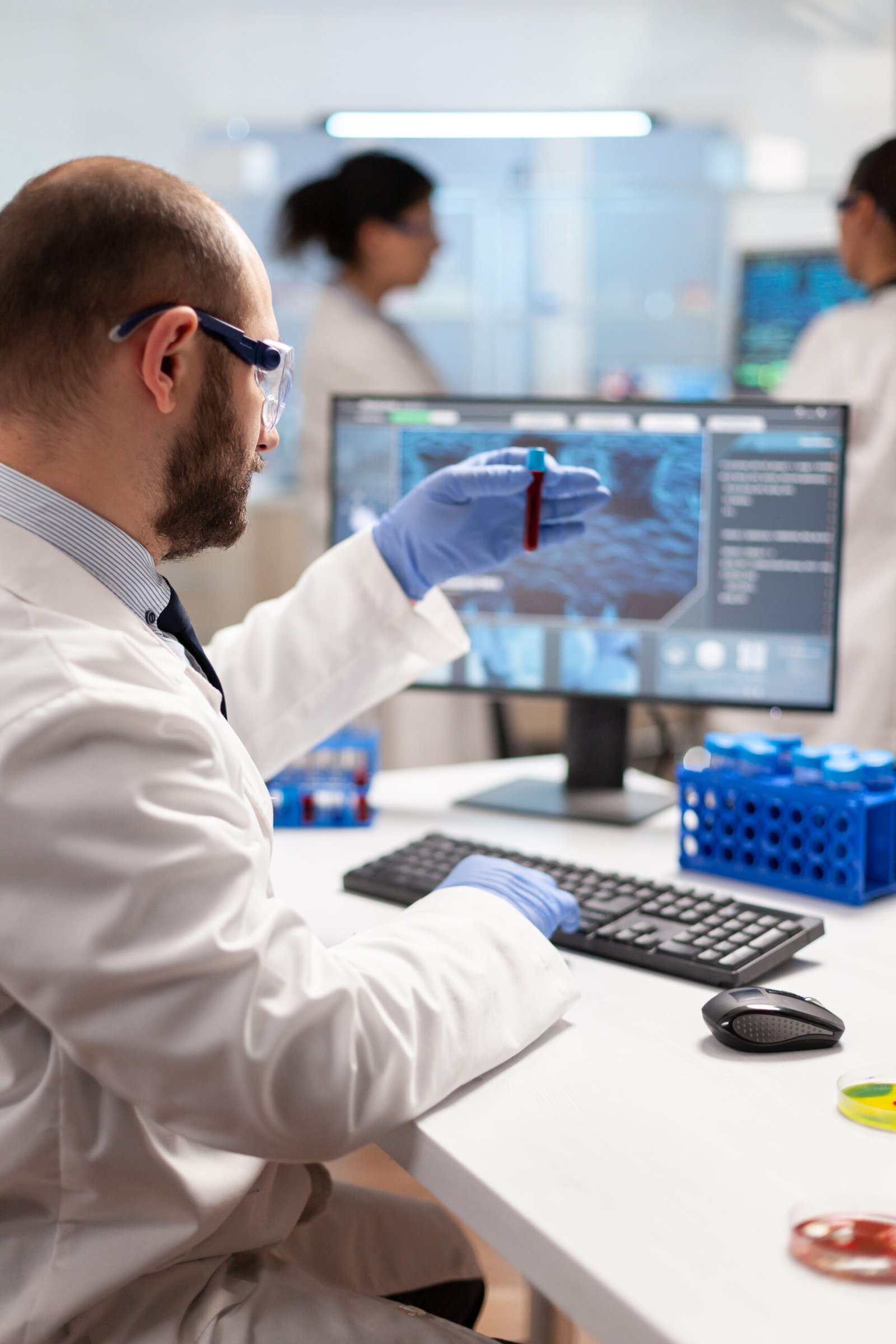 Laboratory professional reviewing medical testing and diagnostic information